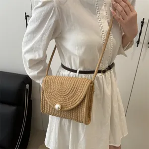 Handmade woven straw crossbody bag with pearl closure, sweet style shoulder mini bag.