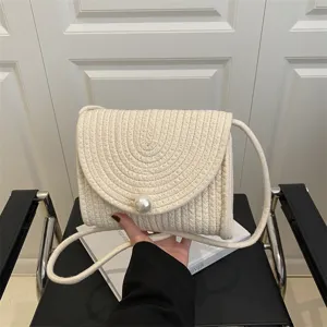 Handmade woven straw crossbody bag with elegant pearl clasp, sweet style casual shoulder handbag.