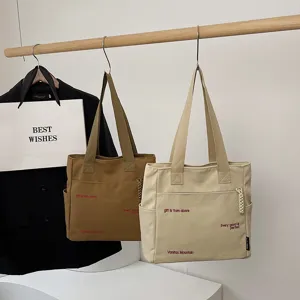 Casual canvas tote bag for women, large capacity shoulder bag with stylish literary design.