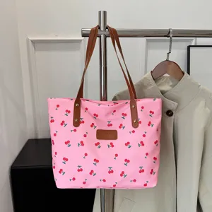 Pink cherry print canvas tote bag with brown handles, casual large capacity shoulder bag for women.