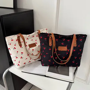 Stylish cherry print canvas tote bag for women, large capacity shoulder bag for work.