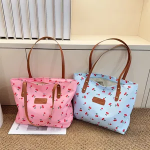Casual canvas tote bag with cute cherry print, large capacity shoulder bag for daily work commute.