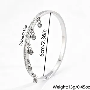 Stainless steel crystal hanging charm bangle bracelet, elegant minimalist fashion jewelry for women.