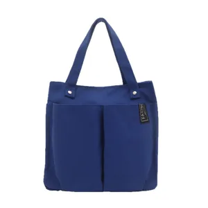 Blaue Canvas Tragetasche mit mehreren Fächern, große Freizeittasche für Arbeit und Alltag.