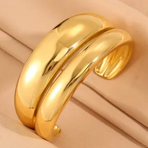 Stainless steel chunky gold double band open cuff bracelet fashion statement jewelry detail shot