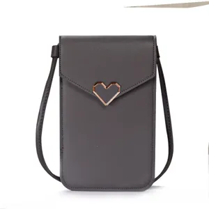Grey mini PU leather phone crossbody bag with chic geometric heart clasp for women daily use.