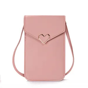 Pink mini PU leather crossbody phone bag with cute gold heart buckle for women daily use.