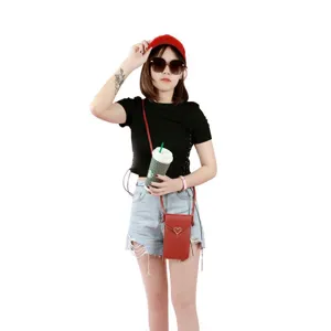 Women mini crossbody phone bag fashion red PU leather small shoulder bag with heart clasp.