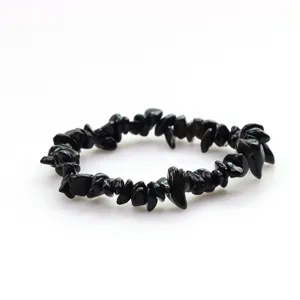 Close-up detail of natural black crystal chip bracelet, irregular polished stone beads.