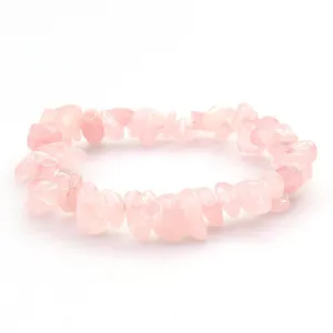 Rose quartz chip bracelet detail view, natural pink crystal irregular stones jewelry accessory.