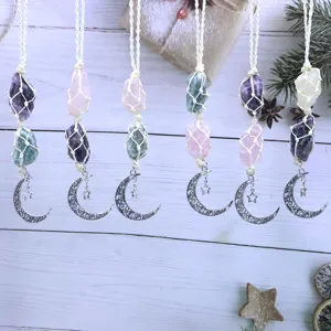 Handcrafted crystal raw stone macrame hanging pendant with crescent moon and star for car decor.