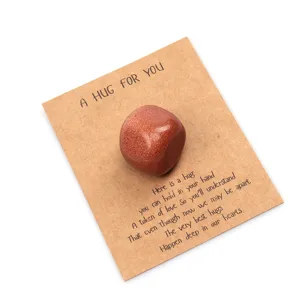 Close-up detail of pocket hug crystal stone on a greeting card, heartfelt gift for loved ones.