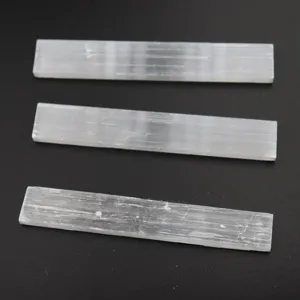Natural white selenite crystal wand rough stone specimen for home decor and healing display.