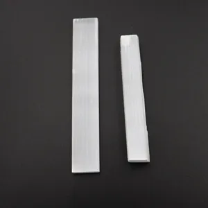 Natural white selenite crystal sticks detail view showing unique texture and crystal structure.