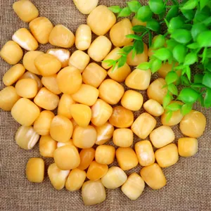 Close-up detail of polished yellow crystal stones ideal for yoga and aromatherapy decor.