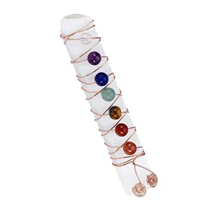 Detailed shot of irregular selenite wand wrapped with copper wire and chakra beads.