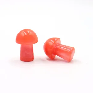 Crystal stone mini mushroom detail view, vibrant orange small garden bonsai landscape ornament.