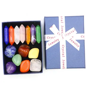 Detailed view of natural crystal healing stones and hexagonal columns set in a blue gift box.