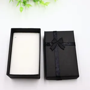 Coffret cadeau noir avec nœud pour bijoux collier bague emballage boîte élégante.