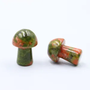 Detail shot of natural unakite crystal mini mushroom ornament for micro landscape decor and diy pots.