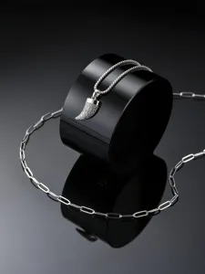 Close-up view of the sparkling cubic zirconia horn pendant and double chain on black display.
