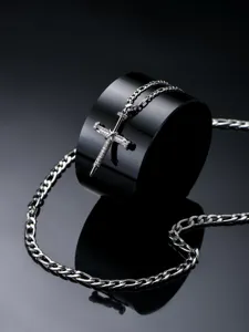 Detailed shot of the hip-hop style stainless steel nail cross pendant with figaro chain.