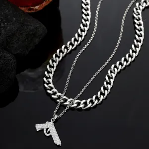 Collar de cadena doble de acero inoxidable estilo hip hop con colgante de pistola brillante.