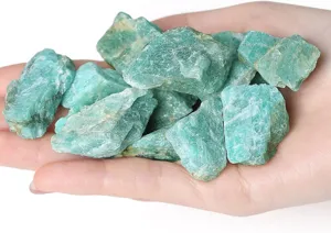 Detail view of natural green aventurine rough crystal stones for healing, decor and landscaping.