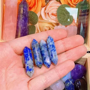Close-up detail of natural blue spot crystal double terminated wands, polished healing stone decor.