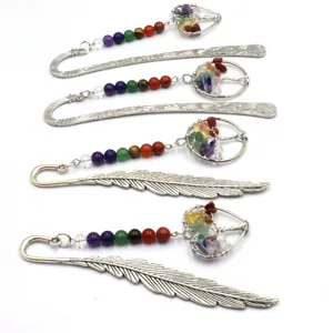 Handmade metal bookmarks set featuring chakra crystal gravel and life tree pendants for reading.