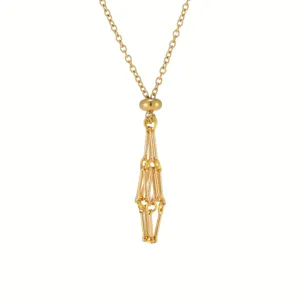 Gold metallic cage pendant detail shot showing the adjustable slider and geometric woven chain.