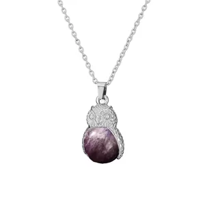 Detailed close-up of the silver owl pendant necklace featuring a natural purple amethyst stone.