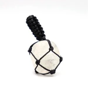 Natural rough crystal stone with black handmade braided rope net pendant necklace detail view.