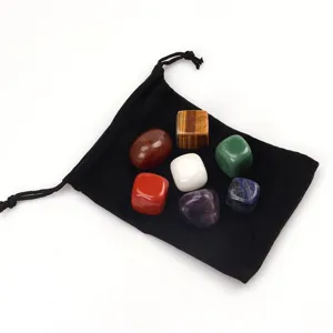 Detailed view of 7 pieces natural crystal tumbled stones set with black velvet storage pouch.