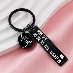 Stainless steel black engraved keychain detail view with sweet love text and driving safety quote.