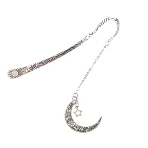 Vintage metal bookmark with moon and sun hollow design, perfect for book lovers.