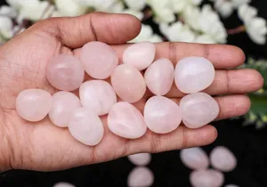 Natural rose quartz tumbled stones for home decor and yoga meditation, smooth polished crystals.