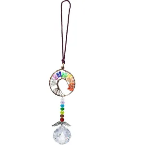 Close-up detail of the copper wire tree of life and faceted crystal ball suncatcher pendant.