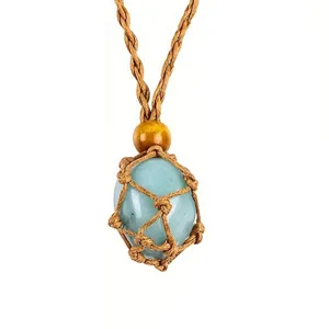 Detailed close-up of the light blue crystal stone inside the handmade woven rope net pendant.
