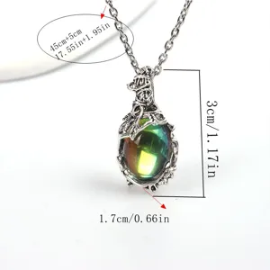 Vintage moonstone pendant necklace with intricate leaf vine design, elegant silver finish.