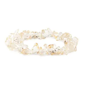 Detailed shot of natural crystal chip stretch bracelet, irregular gemstone beads design.