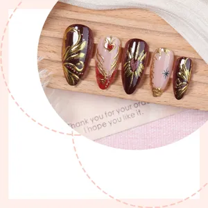 Uñas postizas hechas a mano con diseño floral en relieve dorado y degradado, set elegante.