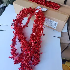 Red Christmas tinsel garland with shiny stars, perfect for holiday tree and party decoration.