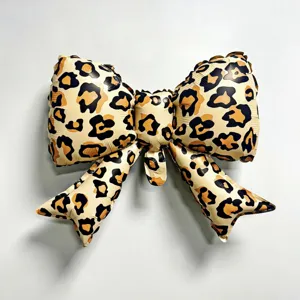 Leopard print bow foil balloon for birthday party decoration, animal theme event supplies.