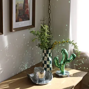 Disco ball mirror cactus and cowboy hat home decor table ornaments with glittering effect.