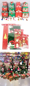 Christmas gift boxes and wrapping bags set with festive Santa and snowman designs for holiday.
