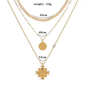 Collier multi-couches doré avec pendentif pièce et croix, bijoux vintage pour femmes.