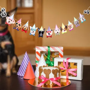 Cute pet dog birthday banner party decoration with funny animal face hats and festive props.