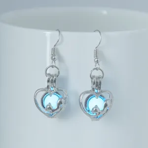 Pendientes de aro con corazón fosforescente, diseño de zorro y perla azul luminosa.