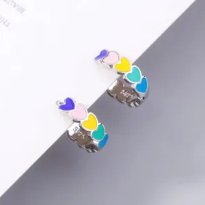 Close-up detail of 925 silver colorful enamel heart hoop earrings with vibrant multi-color stones.